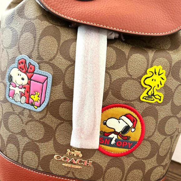 Coach X Peanuts Dempsey Drawstring Backpack In Signature Canvas With Patches - Picture 2 of 8